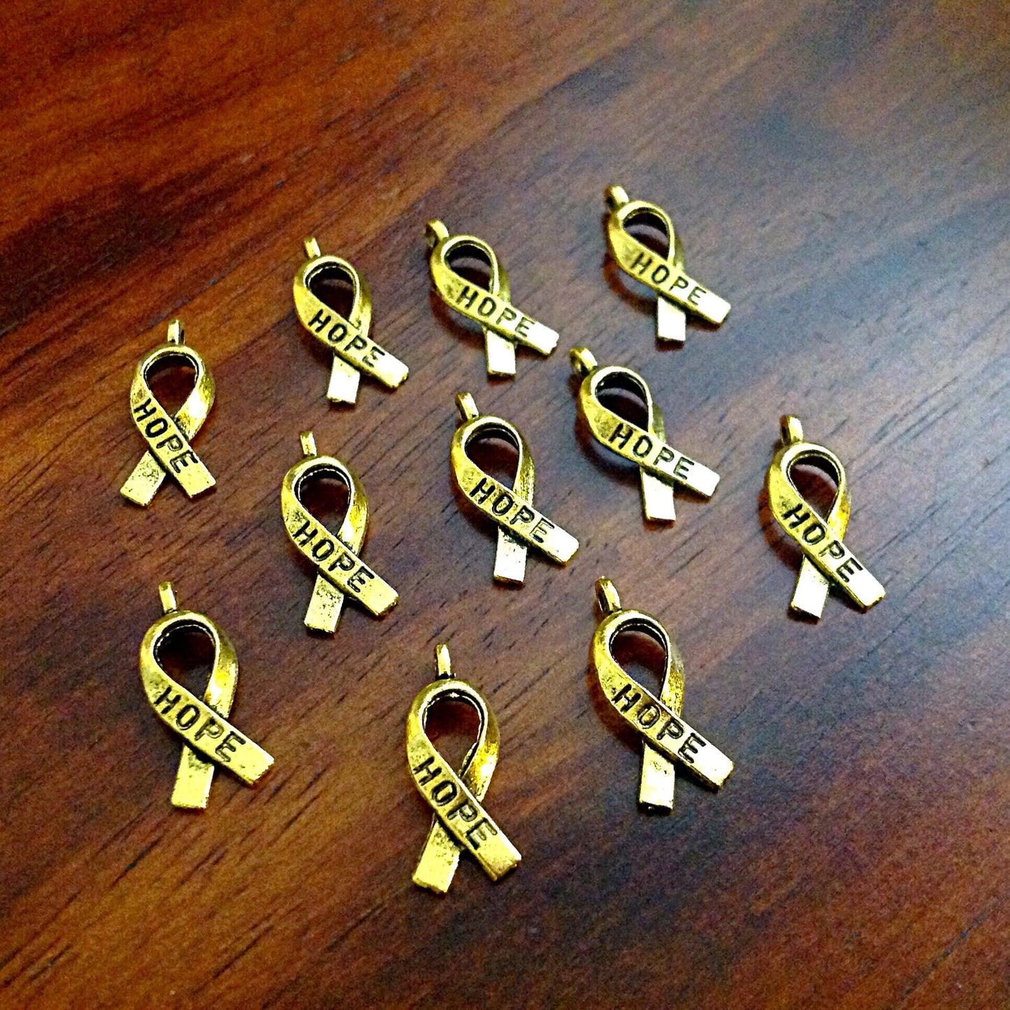 Bulk 50 Hope Ribbon Charms, Antique Gold Charms, Ribbon Charms, Hope Ribbon Charms, Awareness Charms, Jewelry and Craft Supplies, Findings